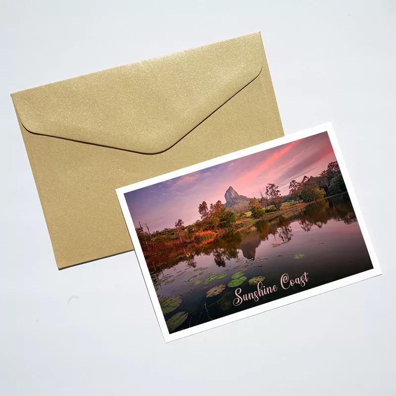 Mount Coonowrin postcard on top of an envelope